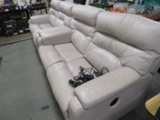 A pair of modern cream, leather electric reclining, two seater settees
