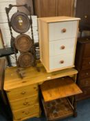 An oak barleytwist dumbwaiter together with an occasional table and a three drawer bedside modern