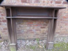 A vintage oak fire surround