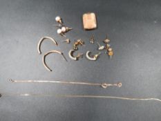 A quantity of scrap gold and yellow metal - mainly earrings