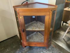 A 20th century mahogany glazed corner cabinet