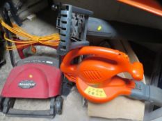 An electric lawn rake and a boxed flymo leaf vac