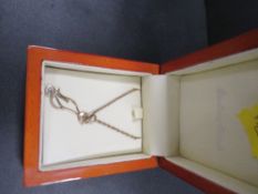 A hallmarked 9ct gold pendant on chain in the form of a cat together with a 375 gold chain,