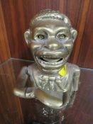 A cast metal brass money bank