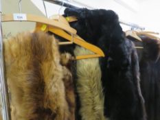 A vintage black fur cape together with a selection of fur stoles and vintage fur coat