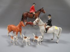 A Beswick hunting scene consisting of huntsman on bay horse, huntswoman on grey horse, three