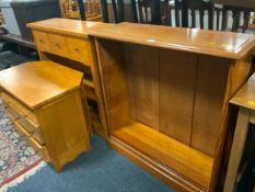 A modern cherry style open bookcase together with a TV media cabinet and another similar bookcase
