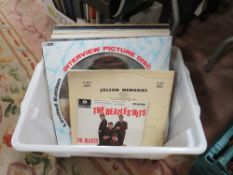 A collection of assorted records to include Beatles EP, limited edition picture disc etc