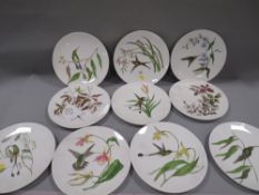 A quantity of decorative plates signed to the reverse and dated 1879- mostly painted with tropical