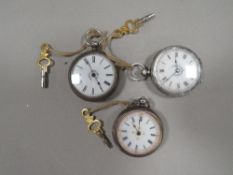 Three antique silver cased ladies pocket watches