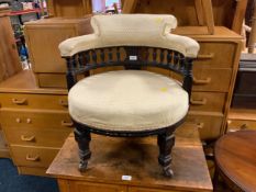 A small Edwardian upholstered tub armchair