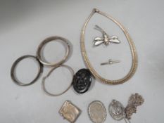 A collection of silver jewellery etc. to include clasp bangle, vesta case etc