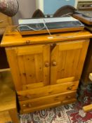 A honey pine cabinet