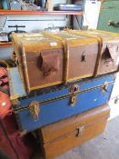 Three vintage travel trunks