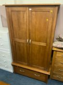 A modern oak Furniture Land style two door wardrobe with drawer below