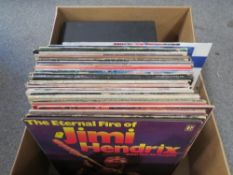 A small Dansette record player together with a selection of LP records to include Elton John, ELO