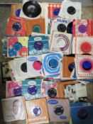 A tray of assorted single records to include Peggy Lee, Beatles etc