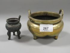 An oriental brass censor with six character mark to base together with a smaller example A/F