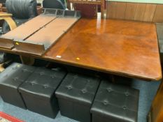 A modern twin pedestal dining table