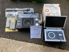 A box of electricals to include Boots projector and instructions, portable DVD payer with