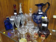 A collection of antique glass to include a blue and clear flash cut ewer (height 34cm) a red and