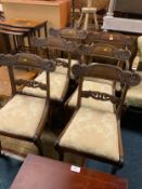 A set of six William IV carved mahogany dining chairs with one carver