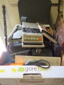 A tray of cameras, radios etc to include a Minolta X-300 with zoom lens , together with a vintage