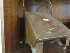 A small Arts and Crafts style copper coal scuttle