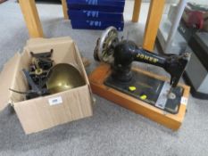 A vintage Jones' sewing machine together with a modern set of scales
