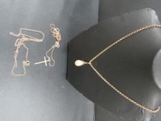 A 375 gold chain - approx. weight 2g, together with two unmarked examples