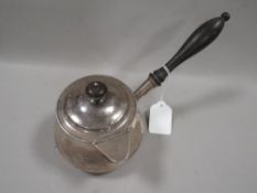 A Georgian hallmarked silver brandy pan and cover by Robert Hennell