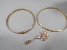 Two hallmarked 9ct gold bangles together with a 9ct gold stick pin in the form of a dolphin, approx.