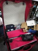 A vintage Samsonite suitcase and contents to include cameras etc