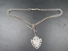 A hallmarked silver graduating Albert chain together with an antique hallmarked silver fob