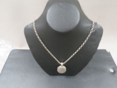 A Victorian silver locket on silver chain