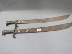 Two ornamental style display swords with griffin handles