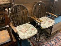 A pair of oak wheel back armchairs to go with an oak triple mirror