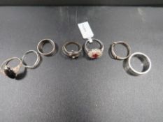 Seven silver and white metal dress rings