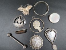 An antique and vintage silver and white metal jewellery to include Niello pendants etc