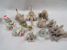 A tray of decorative elephant figures