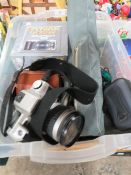 A box of assorted camera equipment to include a Minolta 505 SI super camera