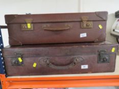 Two vintage leather suitcases