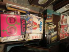 Four trays of mixed magazines and paperback books to include MAD, SHE and VOGUE etc