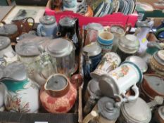 Two trays of assorted water jugs, pitchers and pewter lidded tankards