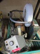 A tray of mixed itmes to inlcude a military helmet, a metal guillotine, a magnifiying lamp and a