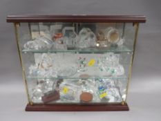 A small display case of glass animals
