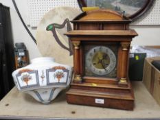 A large vintage mantle clock together with a vintage glass light shade
