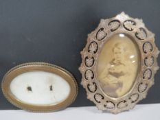 Two antique brass picture frames