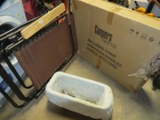 Two folding lounger arm chairs together with a concrete planter