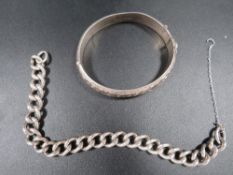 A hallmarked silver chain, together with a hallmarked silver bangle